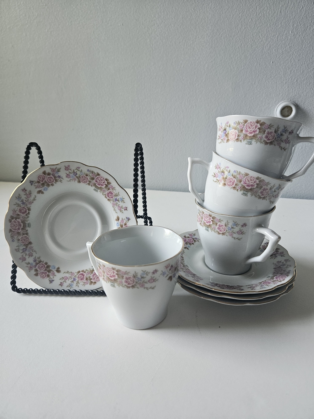 Fine China tea cup and saucer set, featuring pink floral designs and gold trim.